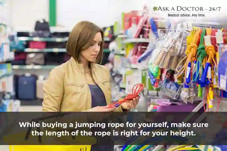 woman selecting and purchasing a jumping rope in a shop=
